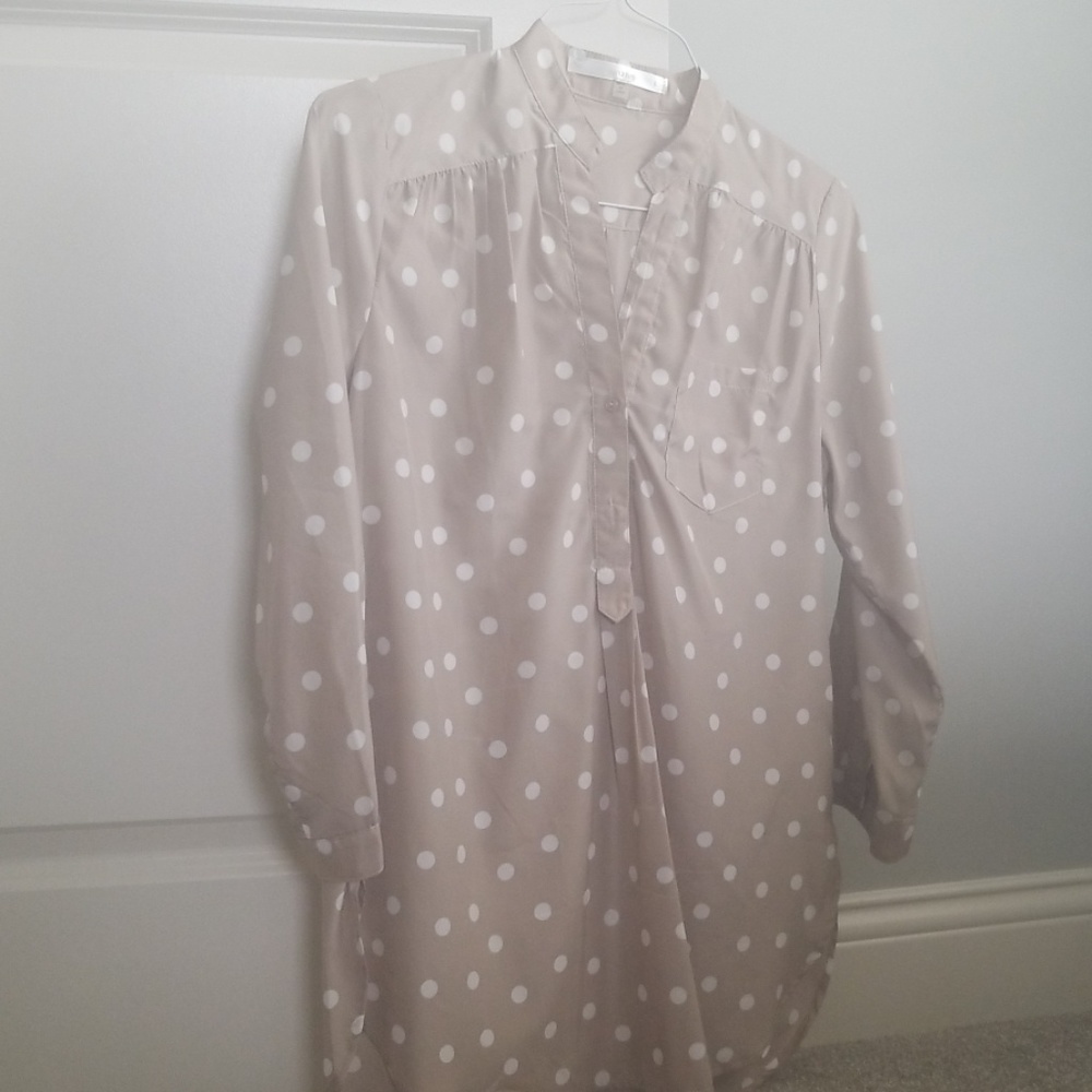 Silk 3/4 length sleeve with white polka dots.